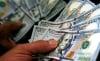 Dólar oscila perto da estabilidade com mercado à espera de Fed e BC