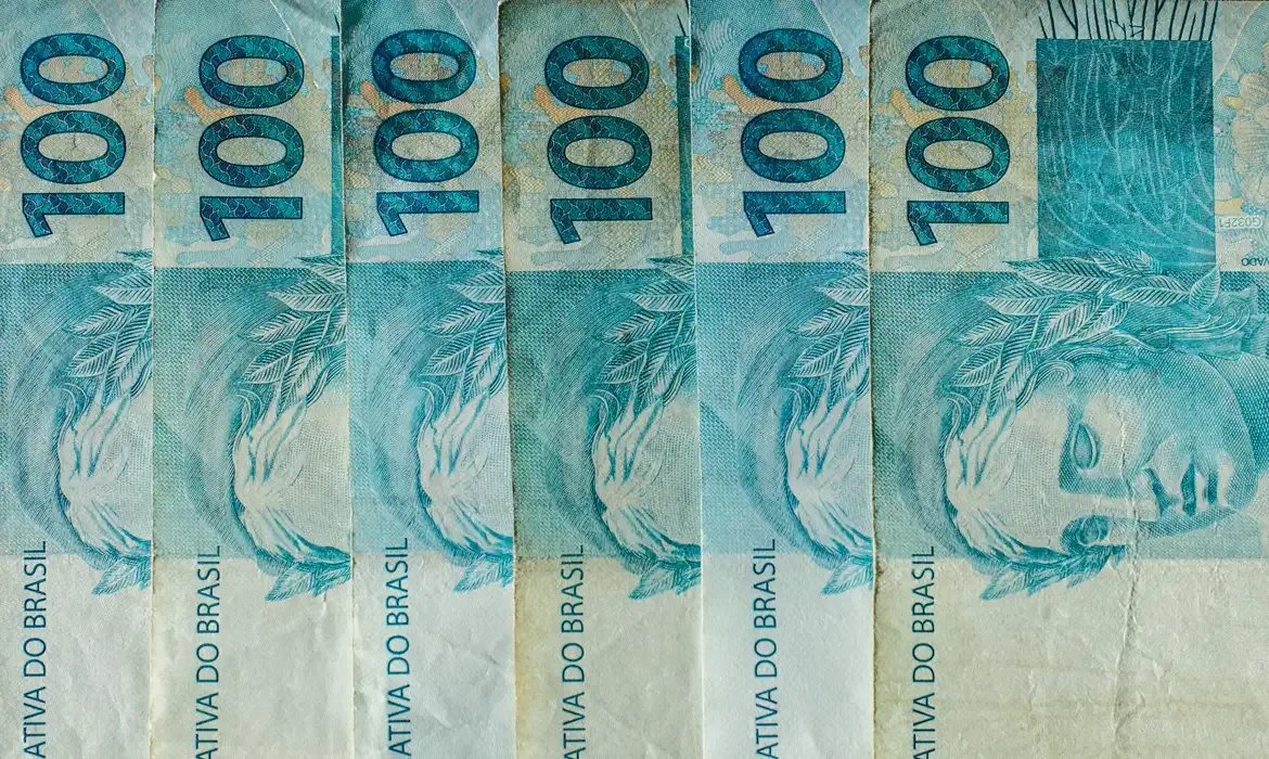 Economia - Caixa paga Bolsa Família de julho a beneficiários com NIS de final 4
